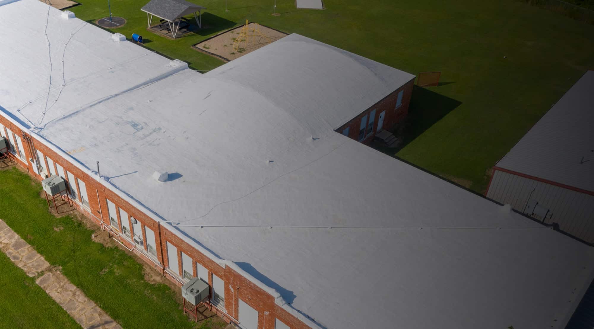 Metal and shingle roofs on school building in Oklahoma