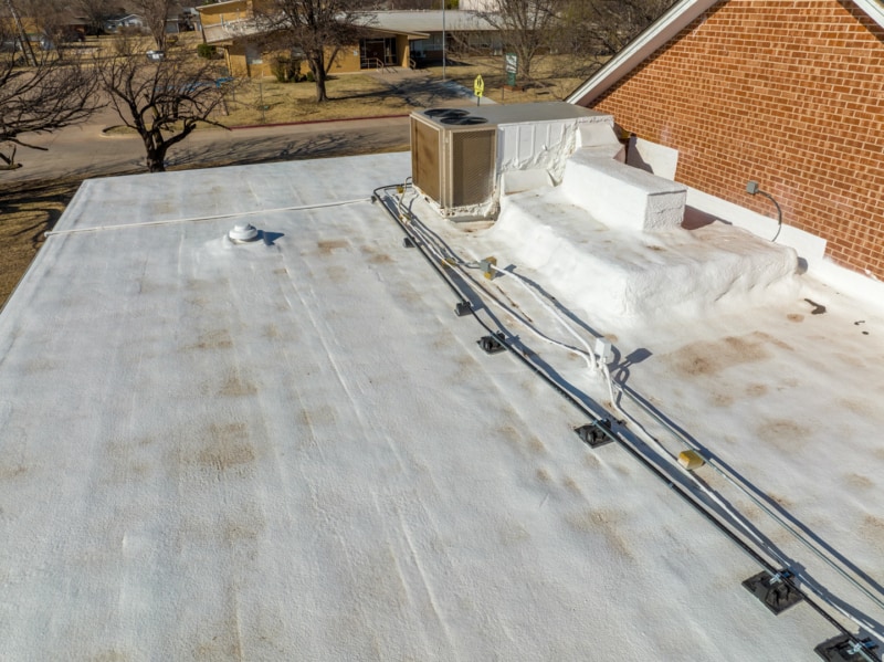 HVAC and electrical conduits on spray foam roof