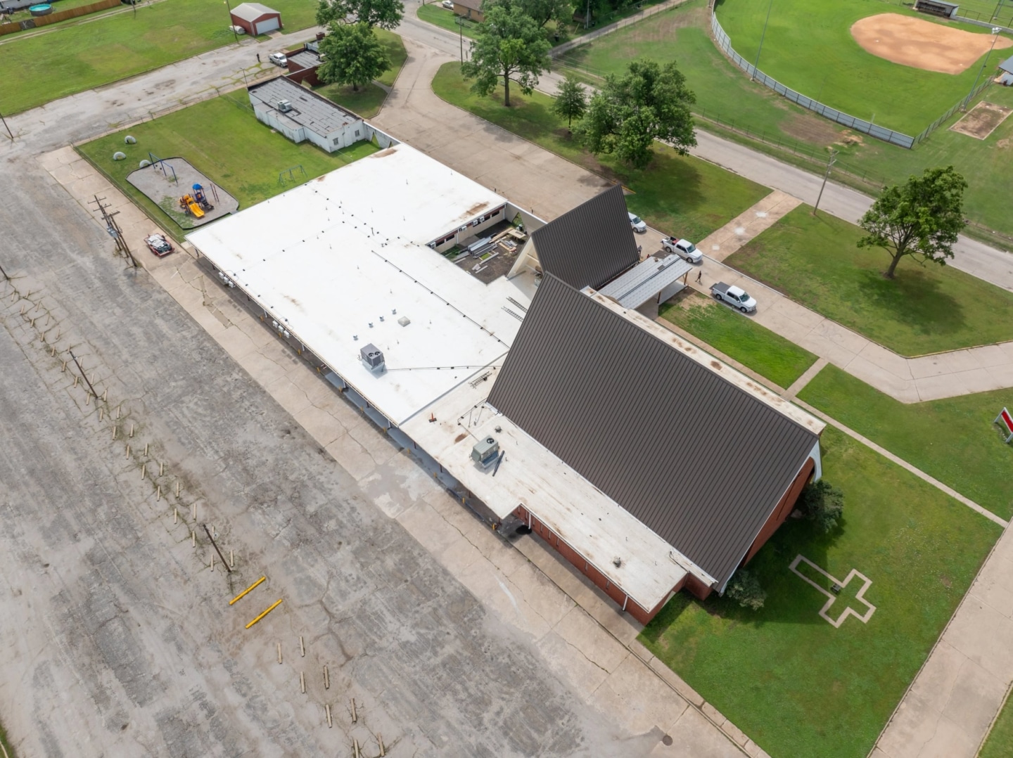 Blackwell First Christian Church Roof Replacement, Custom Single-Length Standing Seam, Commercial Guttering, Flat Roof TPO, Tapered Insulation