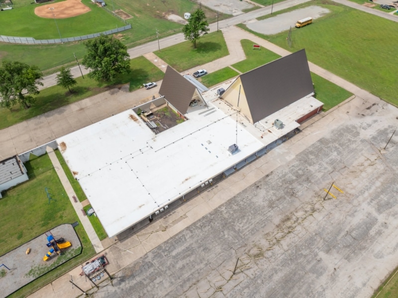 Blackwell First Christian Church Roof Replacement, Custom Single-Length Standing Seam, Commercial Guttering, Flat Roof TPO, Tapered Insulation