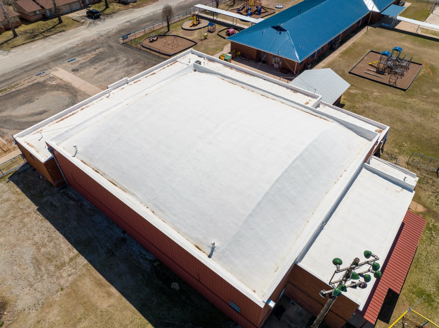 Completed SPF roofing project for a commercial building.