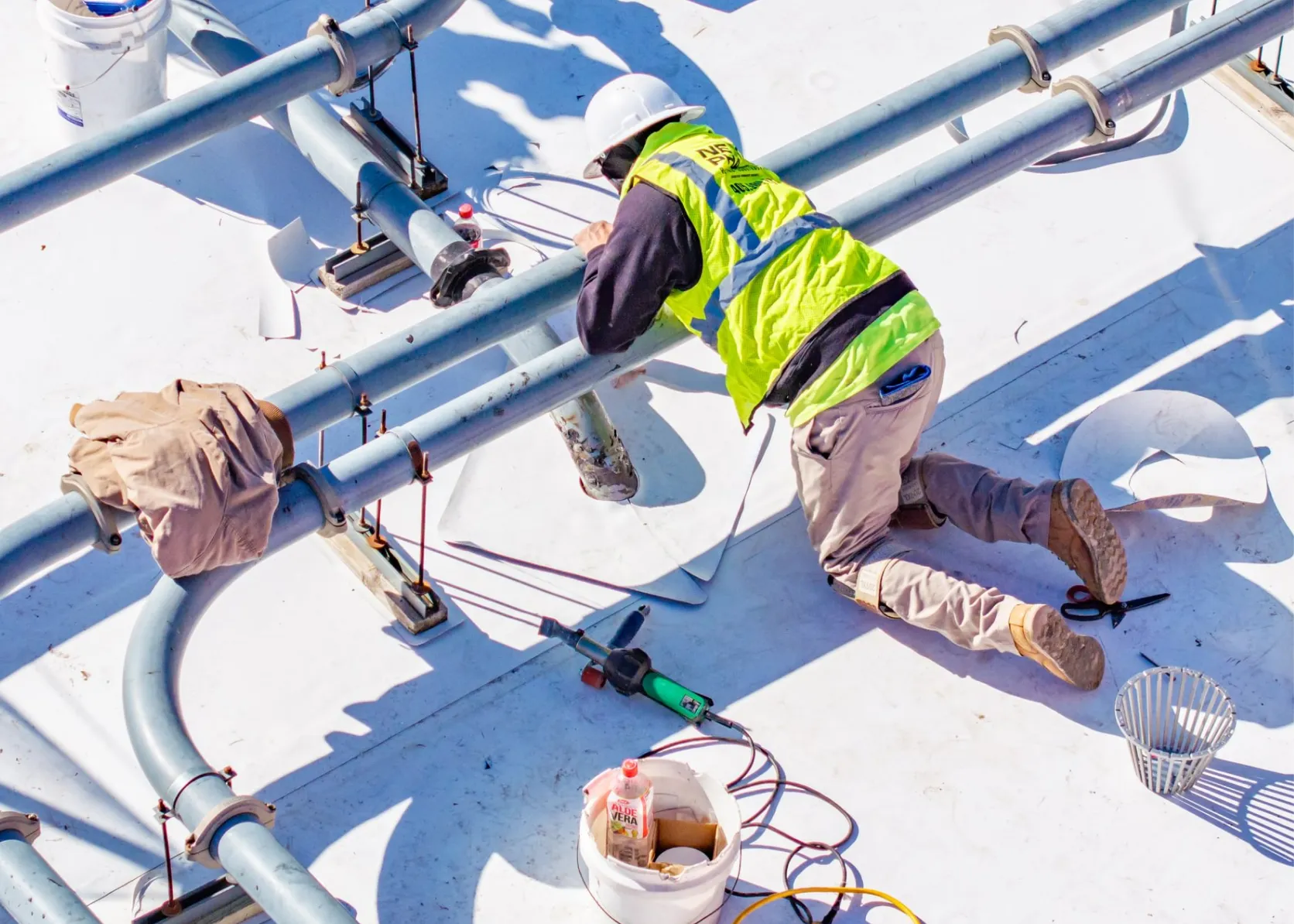 TPO and flashing installation around HVAC and electrical lines