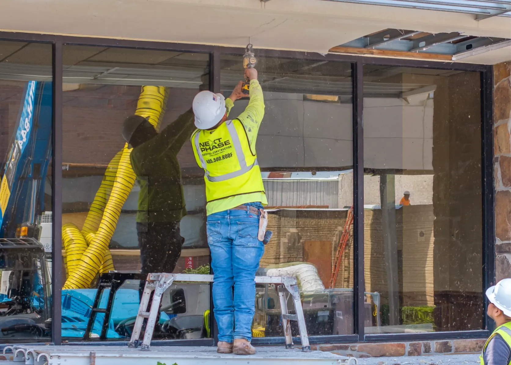 Crew removing damaged soffit panels