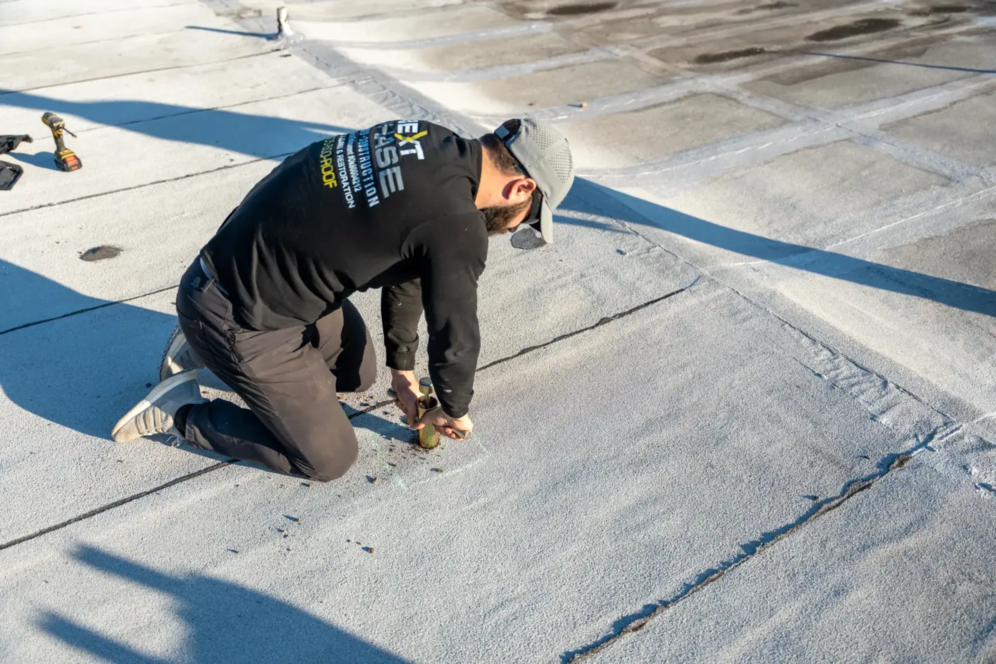 Worker inspecting a flat roof