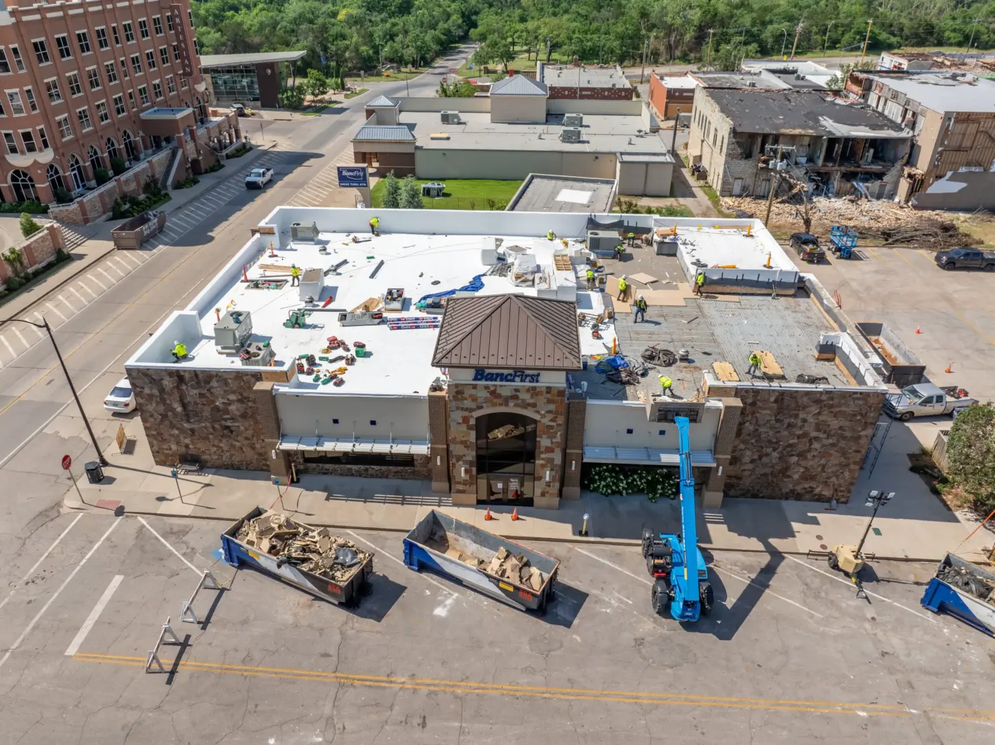 Tornado damage to the flat roof of a bank