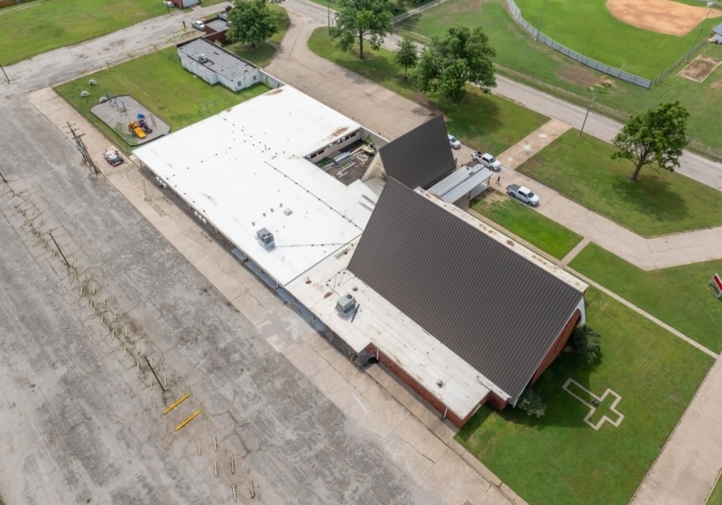 Blackwell First Christian Church Roof Replacement, Custom Single-Length Standing Seam, Commercial Guttering, Flat Roof TPO, Tapered Insulation