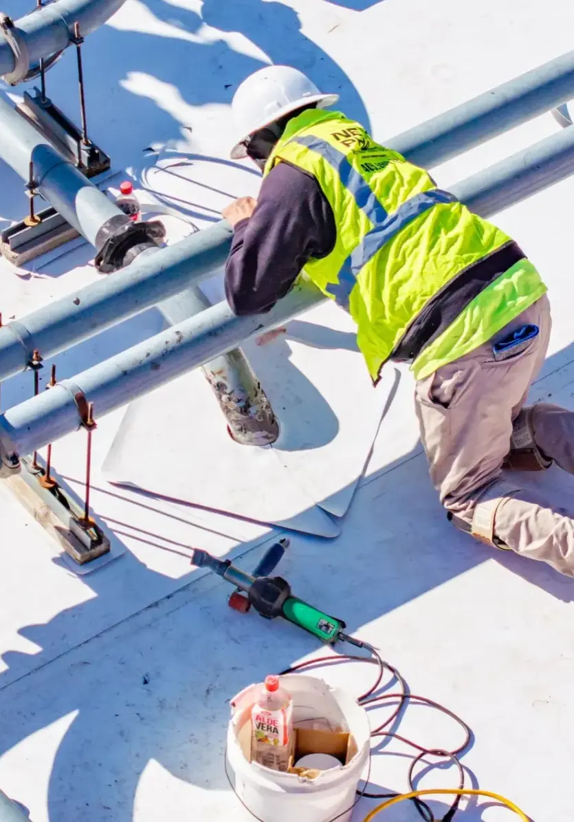 TPO and flashing installation around HVAC and electrical lines